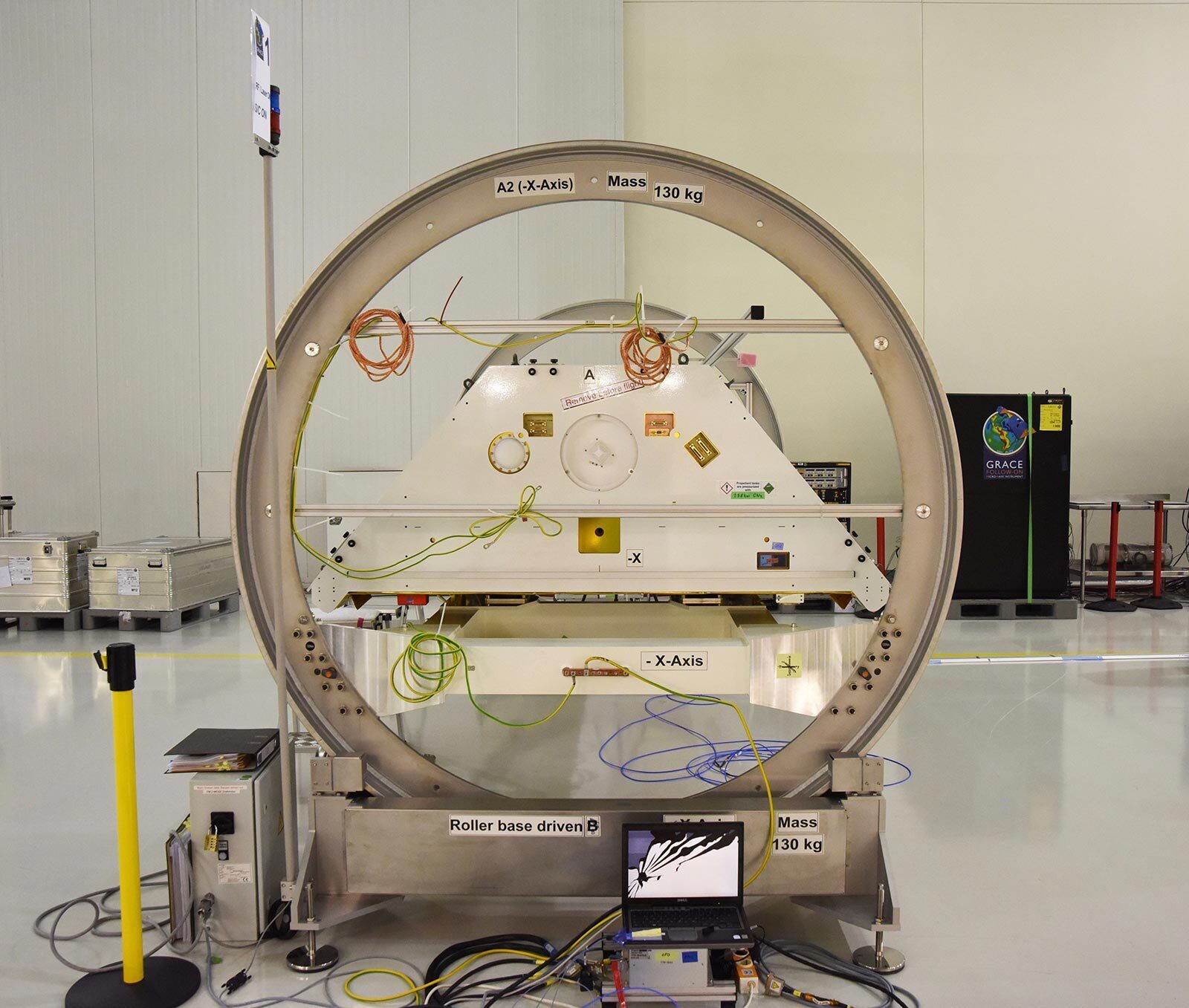 A GRACE-FO satellite and its turntable fixture at the Astrotech Space Operations processing facility at Vandenberg Air Force Base, California.