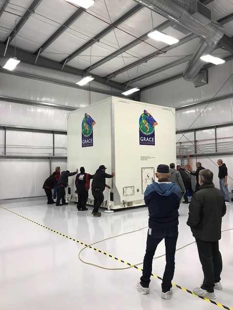 GRACE-FO in a protective shipping container arriving at a new facility at Vandenberg Air Force Base, California.